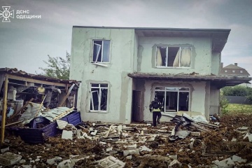Rescuers and local residents at the scene of the fire caused by a Russian strike in Odesa, July 20, 2026