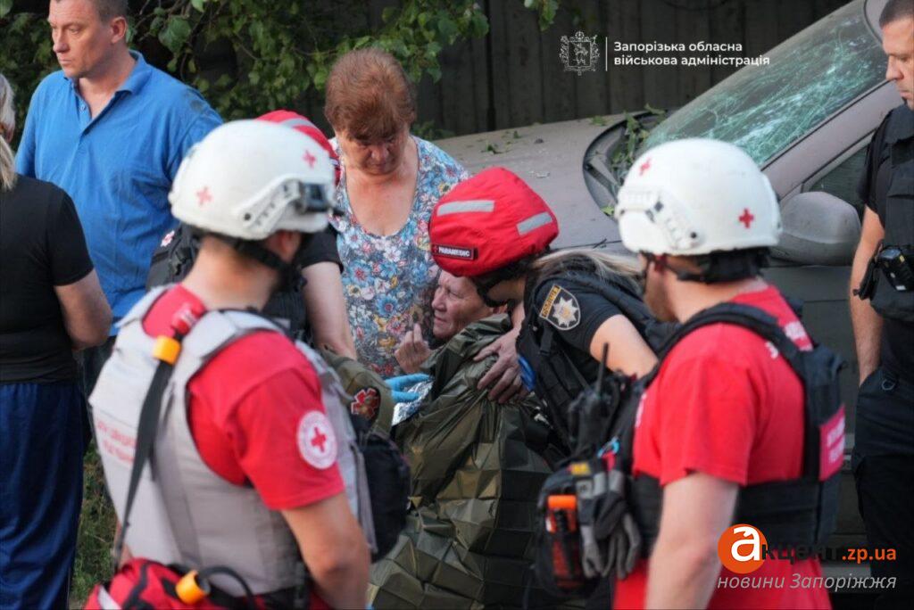 Paramedics assist a resident affected by the night's strikes in Zaporizhzhia