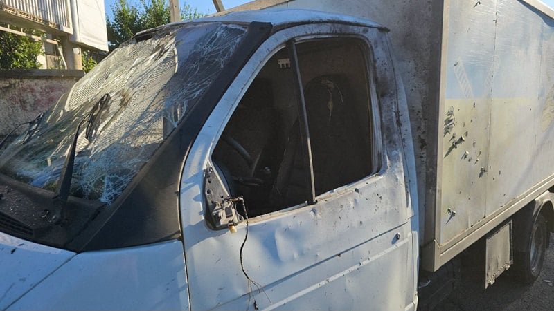 Shattered windshield and damaged cab of the bread-delivery truck struck in Kherson