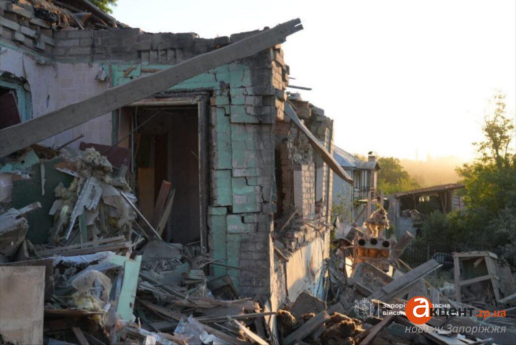 Collapsed brick wall and doorway of the destroyed home at dawn