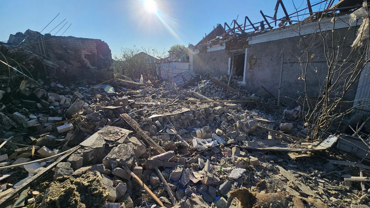 A completely destroyed brick house with collapsed walls after the overnight Shahed strike in Kherson