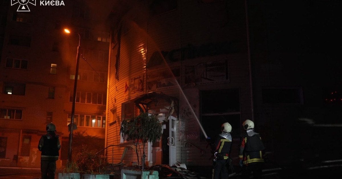 State Emergency Service crews fighting a fire after the overnight strike on Kyiv