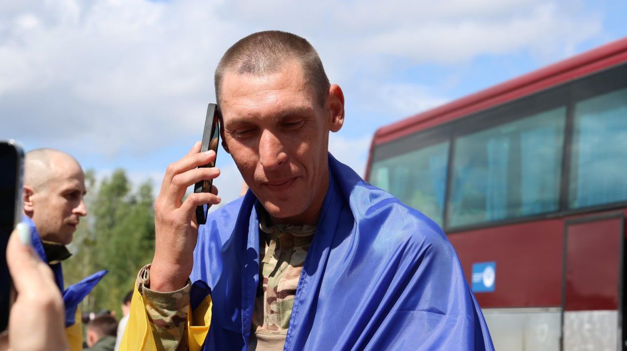 A freed prisoner of war phoning his family moments after returning