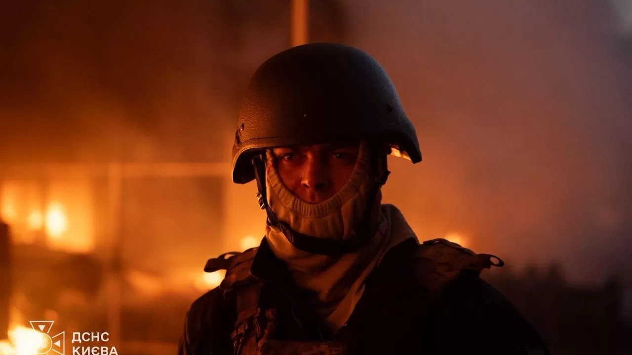 A rescuer from Kyiv's emergency service at the scene of an overnight drone attack