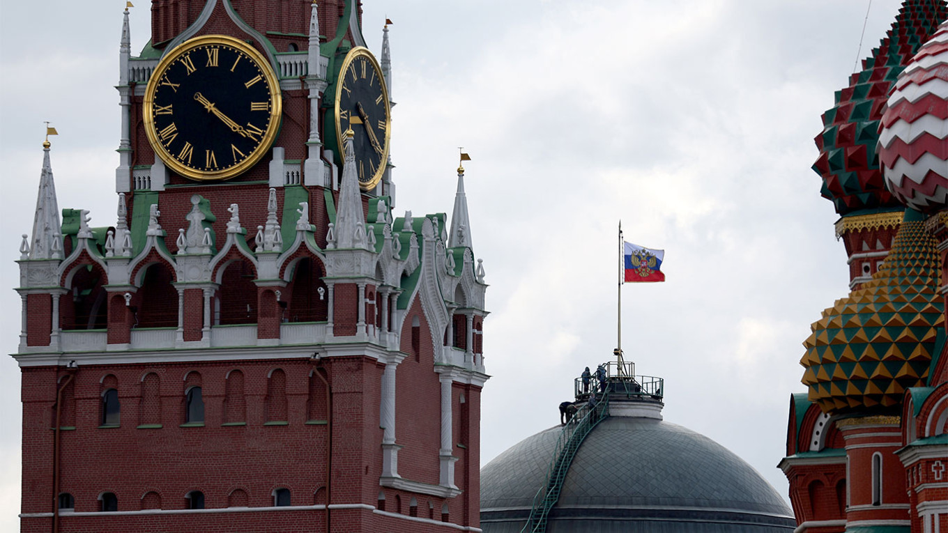 The Kremlin's Spasskaya Tower and St. Basil's Cathedral in Moscow
