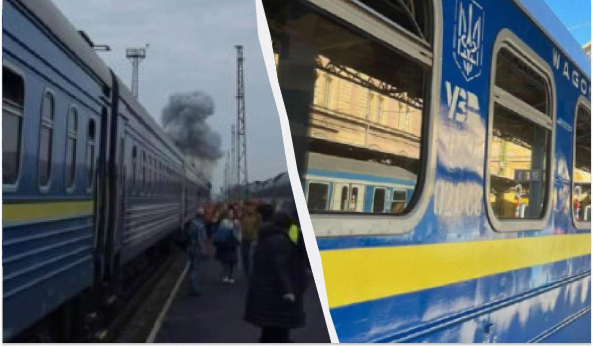 Passengers are evacuated from a train as smoke from the drone strike rises in the distance