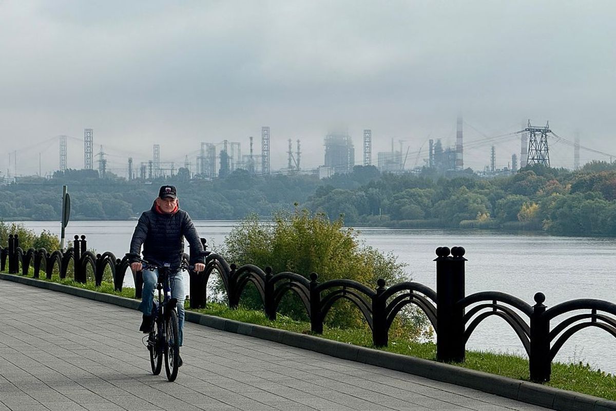 The Moscow oil refinery seen against a backdrop of smoke from the fire
