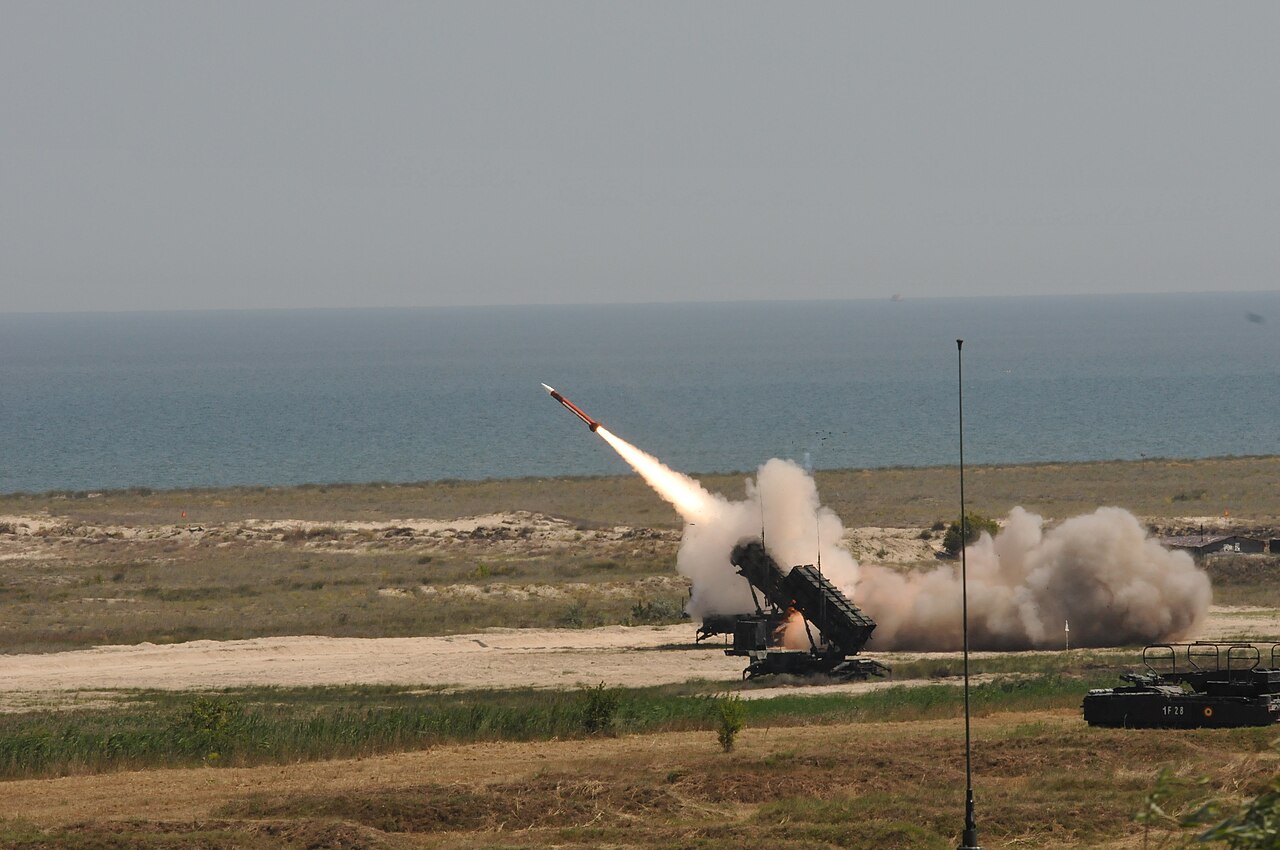 A Patriot air defense system fires an interceptor missile during a live-fire exercise