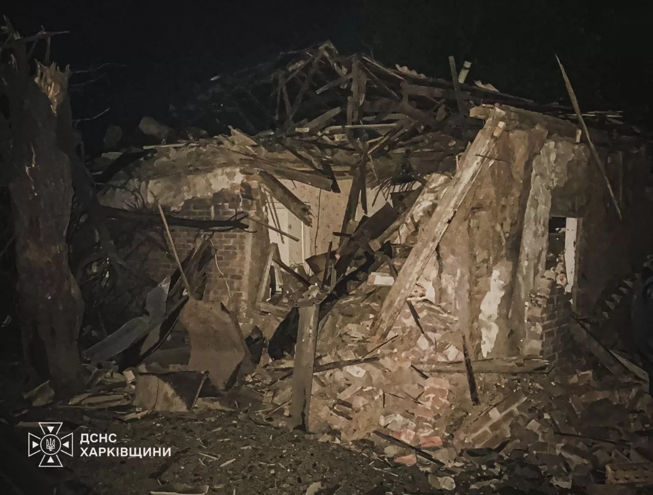 A firefighter works inside a burned-out building in Lozova after a Russian drone strike