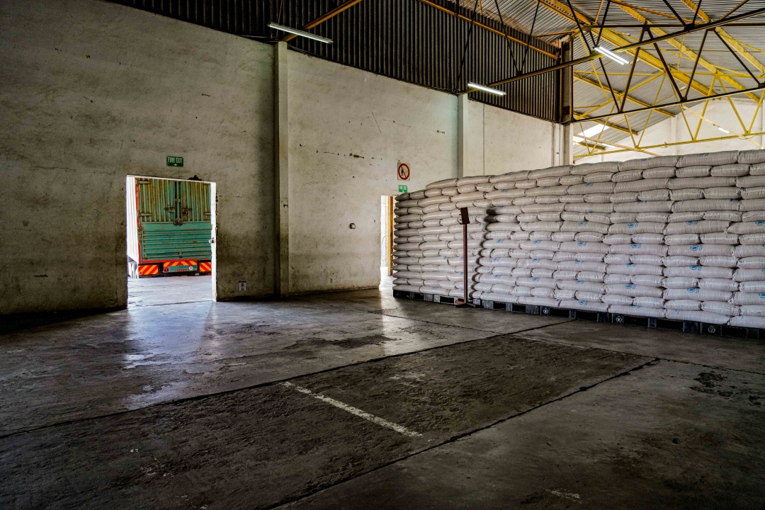 A 50kg sack of yellow split peas marked "Gift of Food from Ukraine" at a warehouse in Malawi