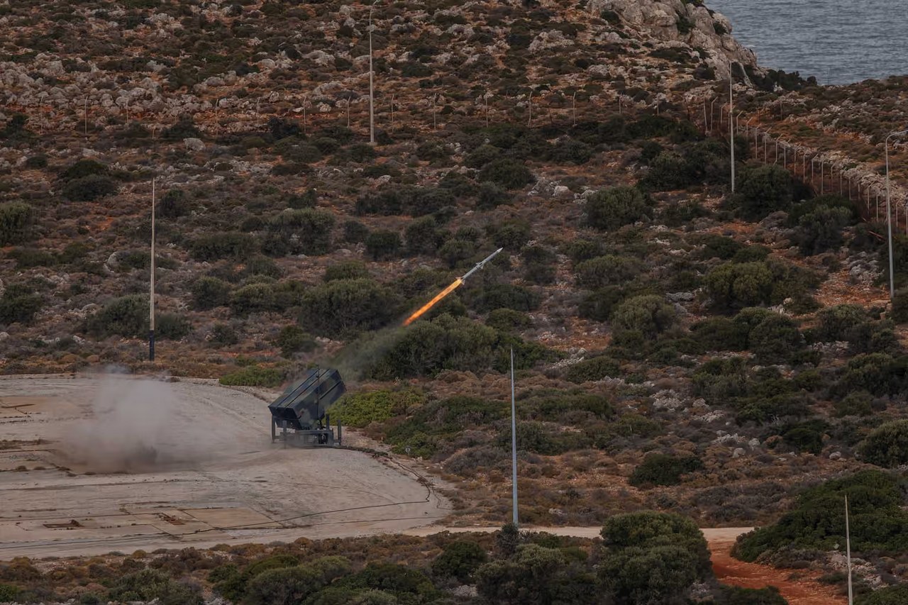 Illustrative photo: an AIM-120 missile launched from a NASAMS system