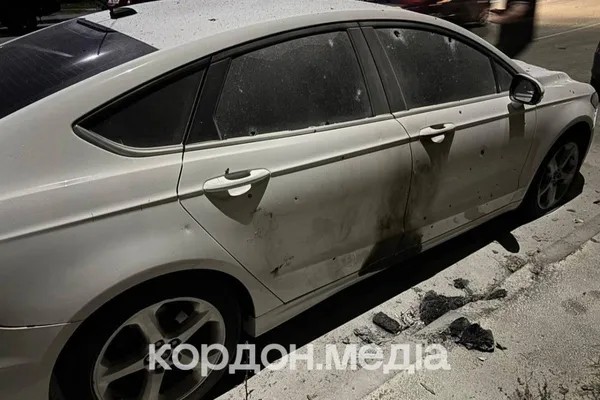 A car damaged by shrapnel from the drone strike near the residential building in Sumy