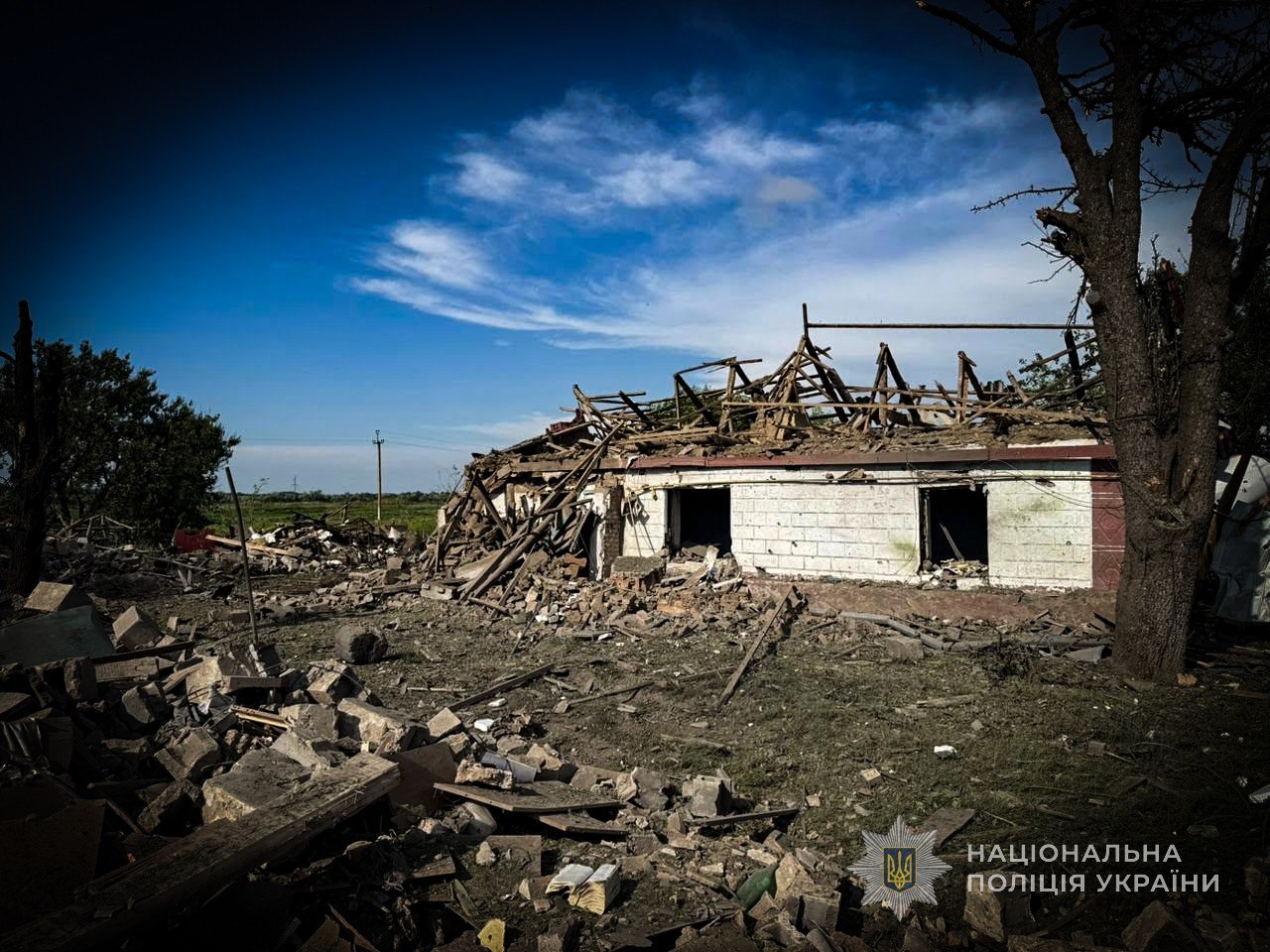 Police document the aftermath of a strike on a home in Zaporizhzhia Oblast