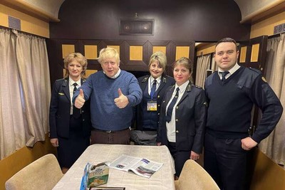Boris Johnson poses with the conductors of a Ukrainian train
