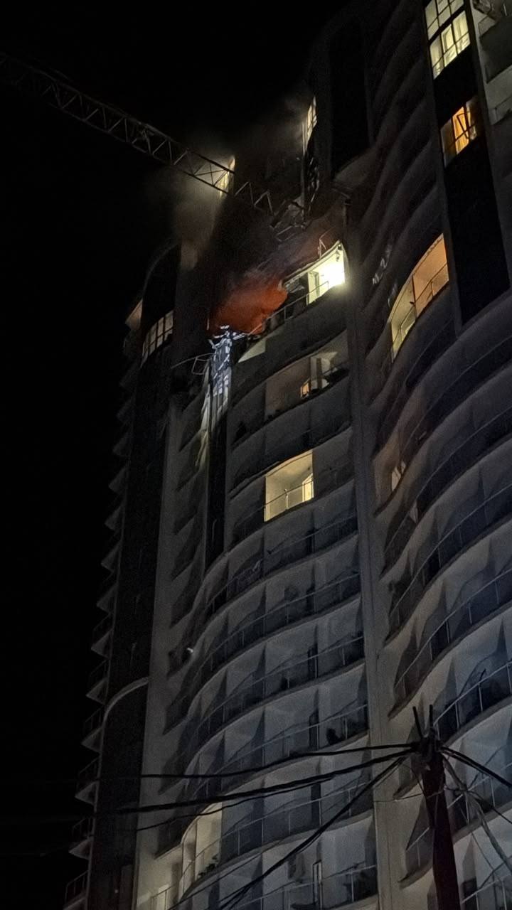 A 19-story building in Odesa with damage to its upper floors after the overnight attack