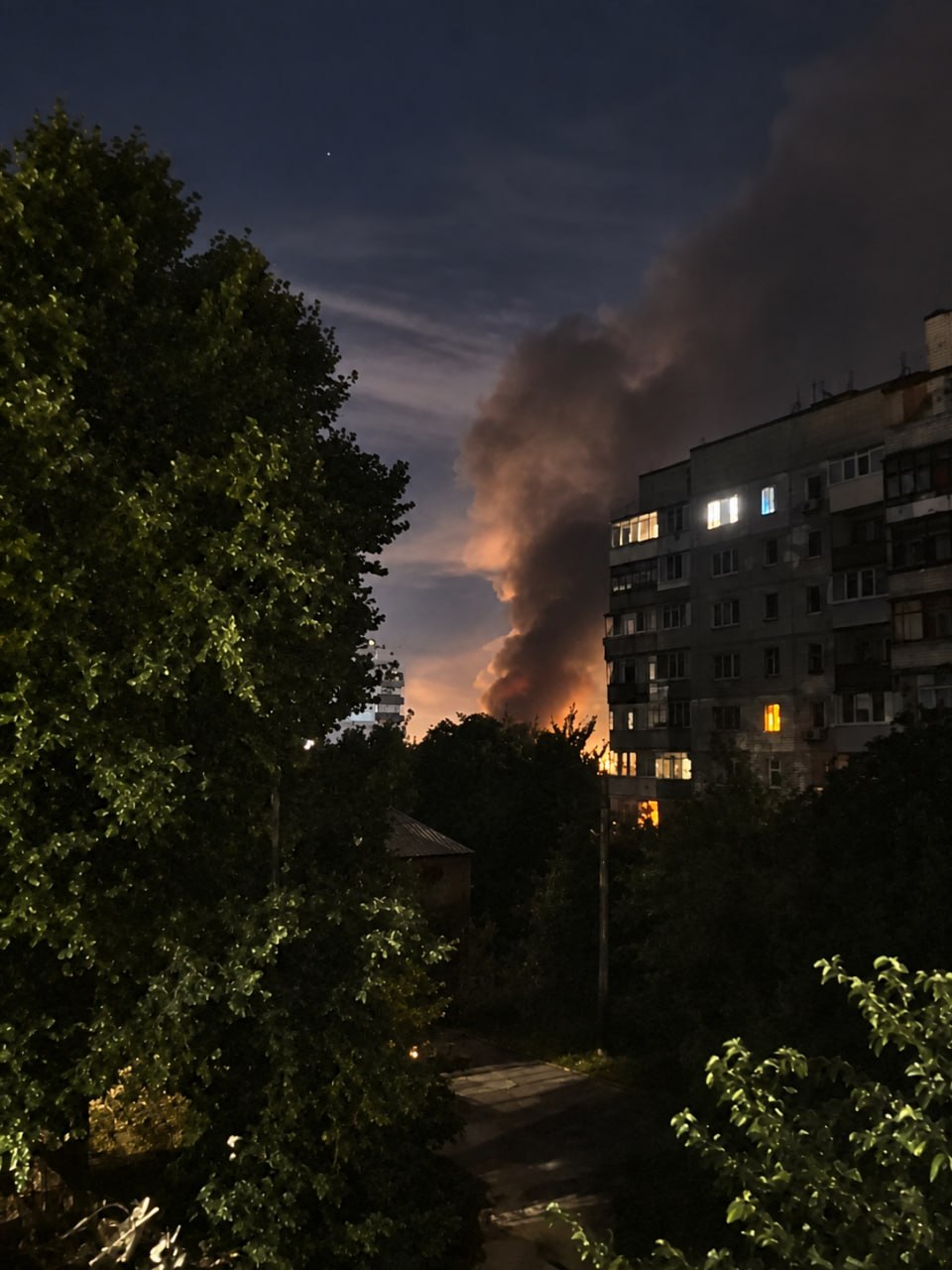 Dnipro silhouetted against a fire following the overnight strike