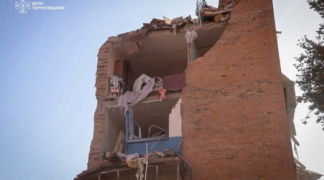 A damaged wall of the building after the missile hit