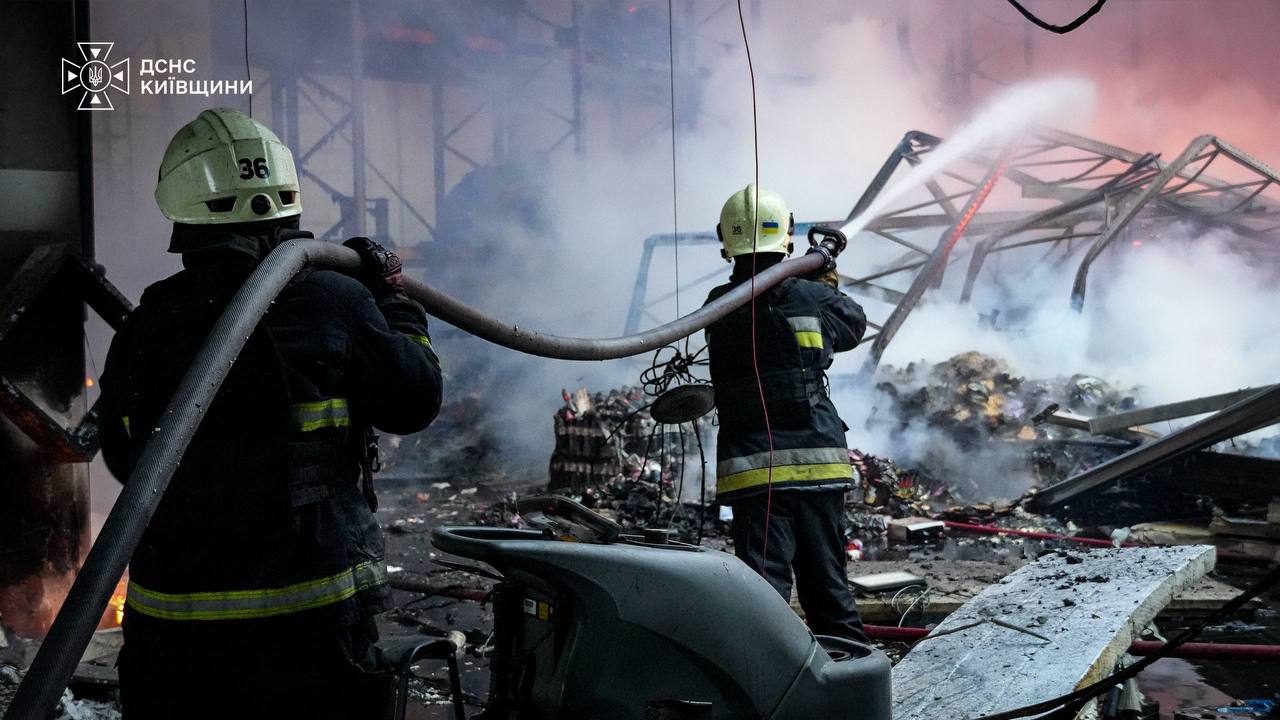 Rescuers fighting a fire at a logistics facility in the Bucha district of Kyiv Oblast