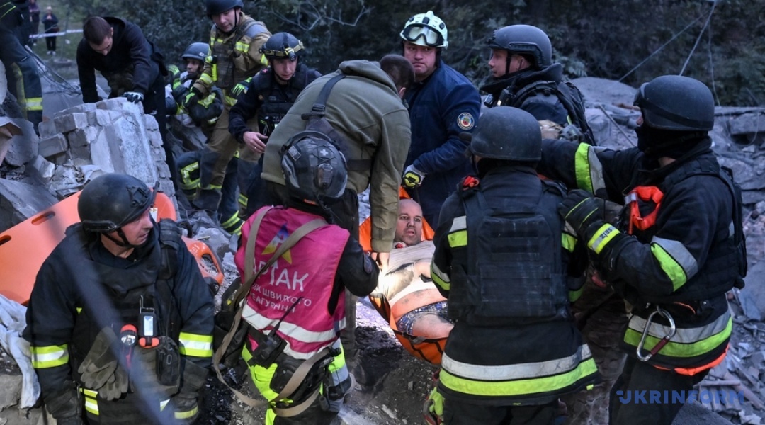 Rescuers and medics with an injured person on a stretcher