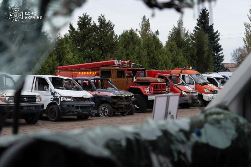 A row of damaged rescue vehicles at a DSNS site