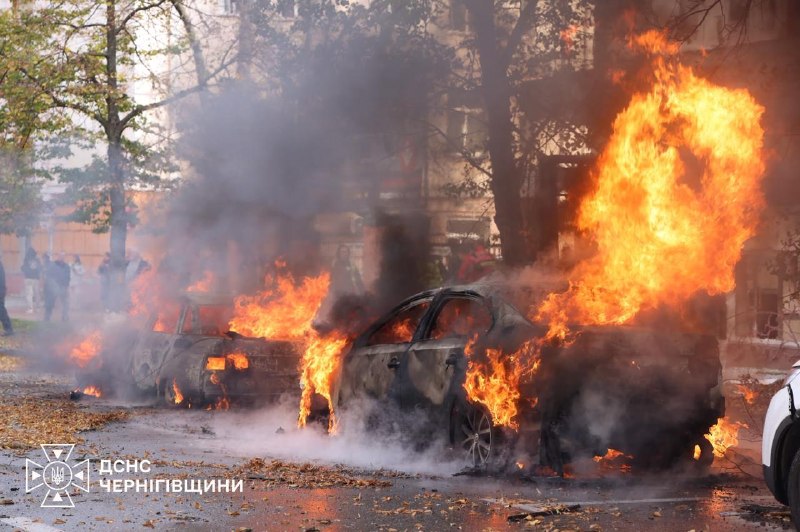 A burning car on a street in central Chernihiv