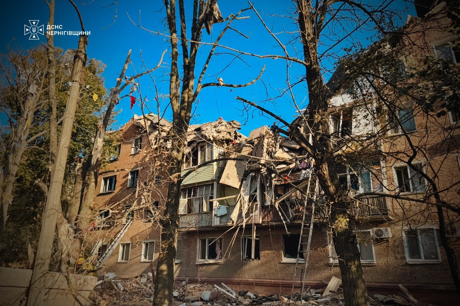 Collapsed section of the apartment building in Pryluky after the missile strike