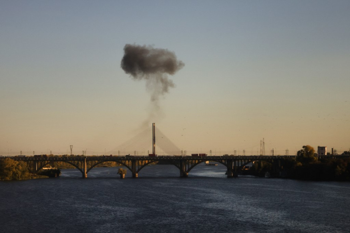 Smoke rising over one of Kyiv's bridges after a Russian attack