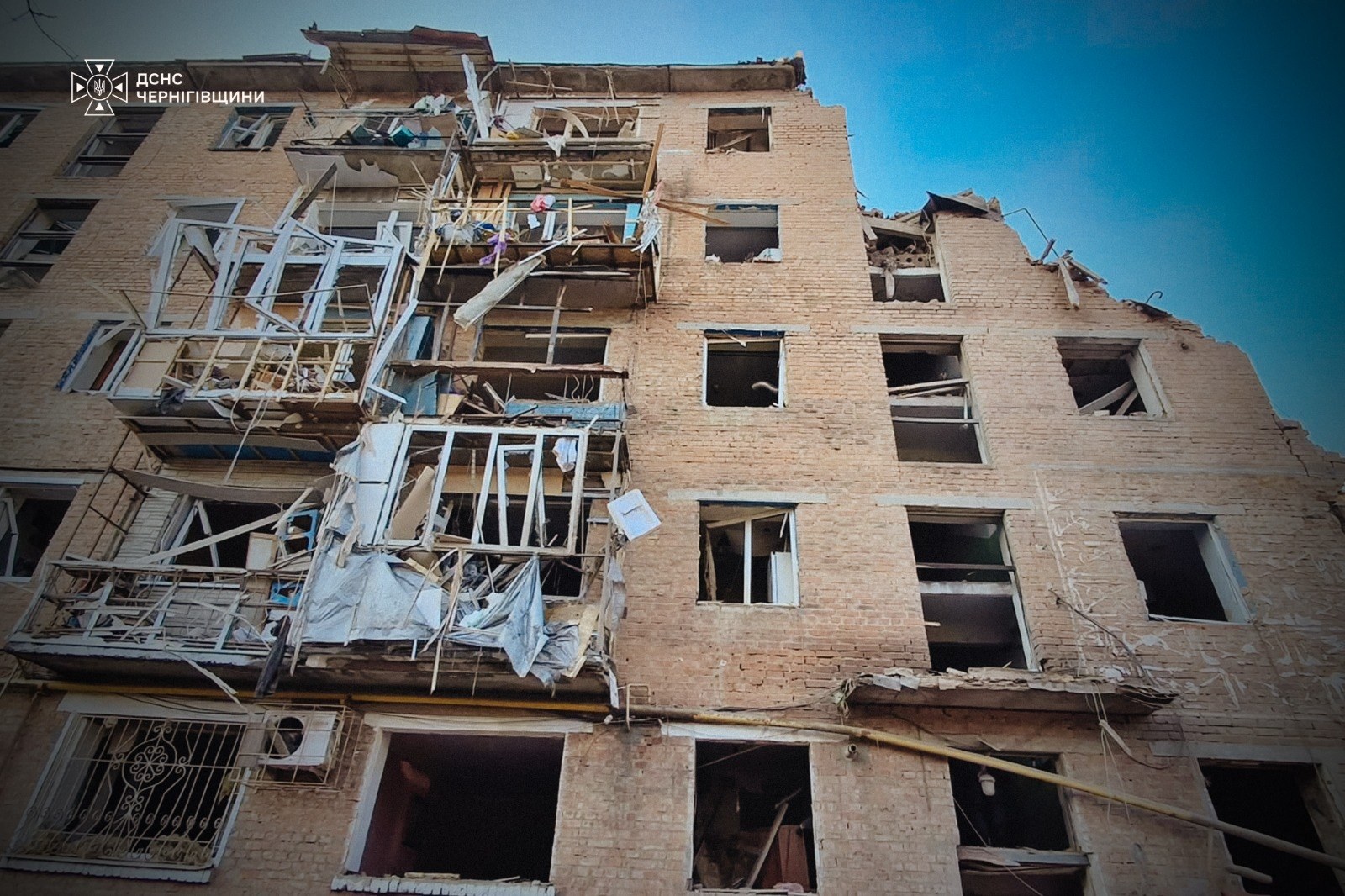 A building in Pryluky with wrecked balconies and windows after the strike