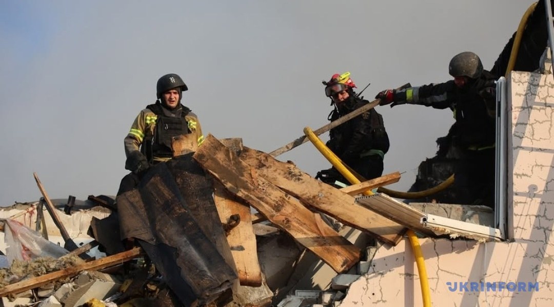 Firefighters and rescuers on the debris of a building in Kharkiv (photo: Ukrinform)