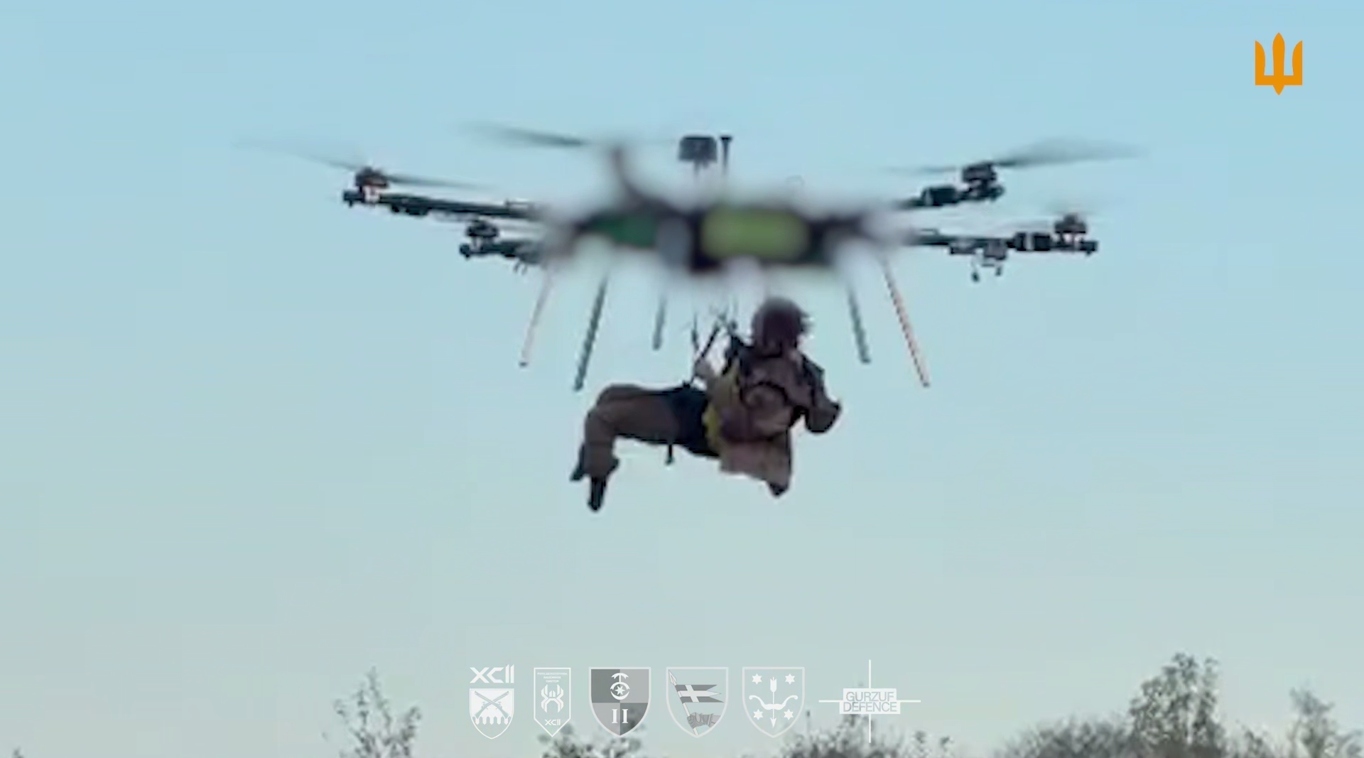 Screenshot of a 30th Mechanized Brigade video: the wounded soldier beneath the Ayudag-6 drone