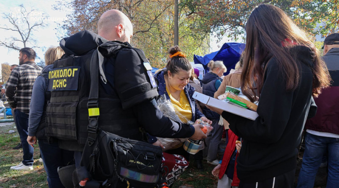 A State Emergency Service psychologist works with residents at the scene