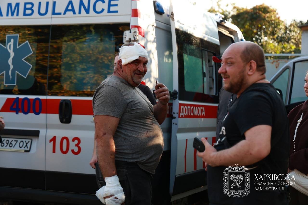 Injured people next to an ambulance in Kharkiv