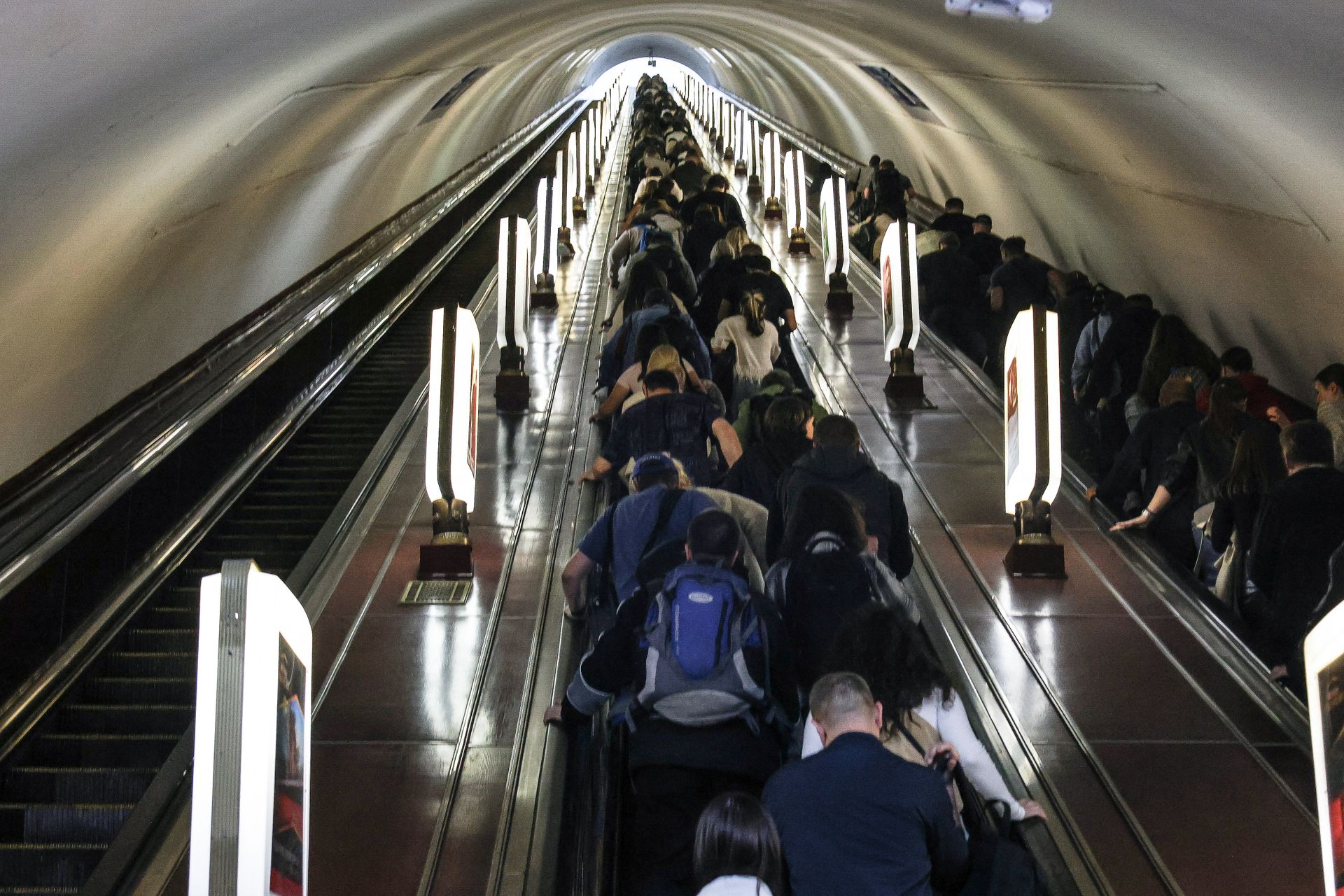 Passengers leave a Kyiv metro station after the escalators stopped
